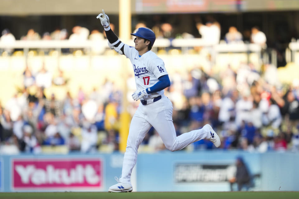 Los Angeles Dodgers designated hitter Shohei Ohtani (17) runs the bases after hitting a home run during the third inning of a baseball game against the Atlanta Braves in Los Angeles, Saturday, May 4, 2024. (AP Photo/Ashley Landis)