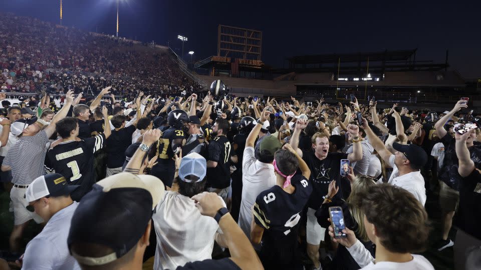 Vanderbilt Commodores players and fans celebrate following their win. - Matthew Maxey/Icon Sportswire/Getty Images