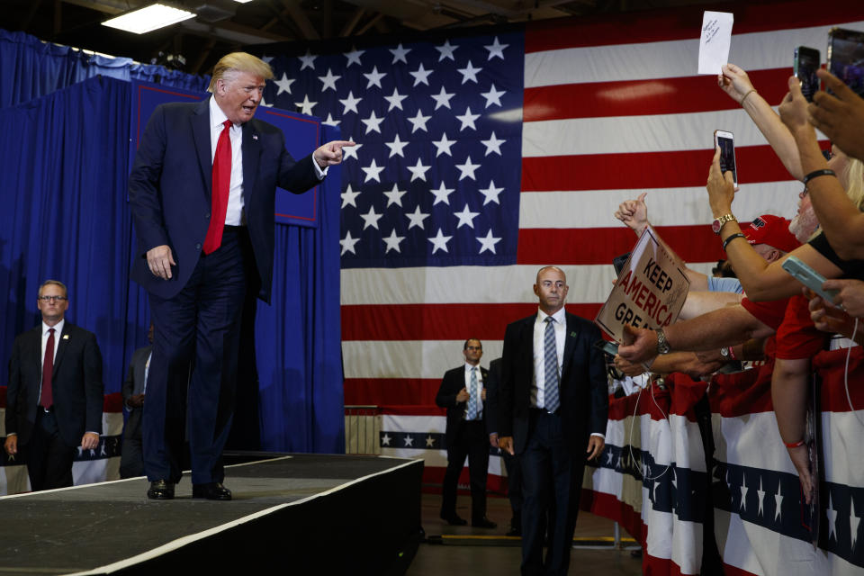 President Donald Trump arrives on stage at the Crown Expo for a campaign rally, Monday, Sept. 9, 2019, in Fayetteville, N.C. (AP Photo/Evan Vucci)