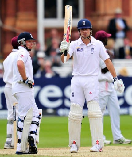 England cricketer Alistair Cook (right) reaches his half-century at Lords cricket ground in London. Cook and Ian Bell led England to victory in the first Test against the West Indies