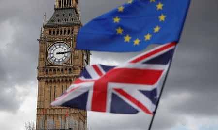 File Photo - The Union Flag and a European Union flag fly near the Elizabeth Tower, housing the Big Ben bell, during the anti-Brexit 'People's March for Europe', in Parliament Square in central London, Britain September 9, 2017. REUTERS/Tolga Akmen