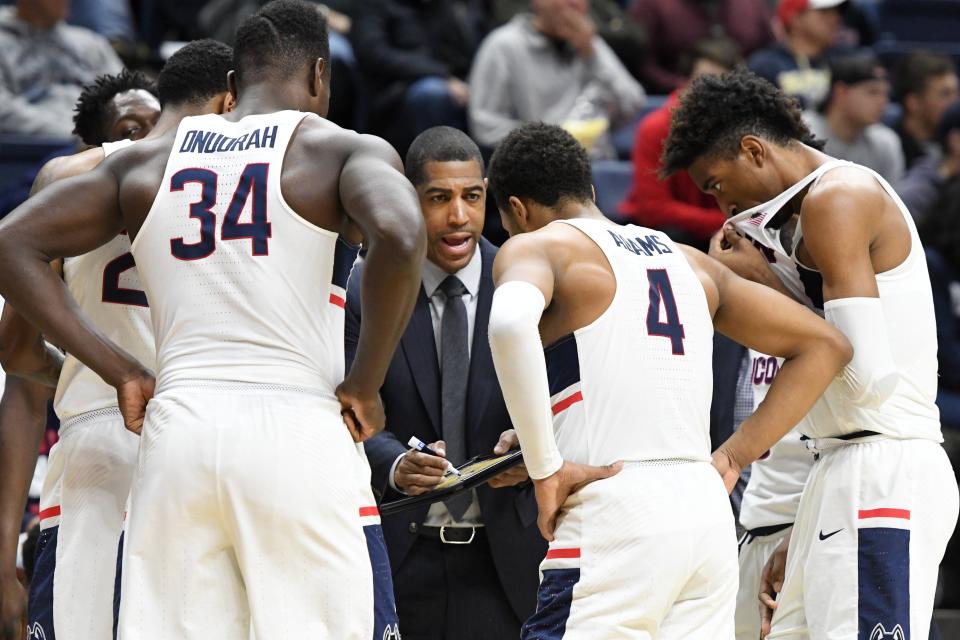 Connecticut coach Kevin Ollie draws up a play during the second half against South Florida in Storrs, Conn. on Feb. 7, 2018.