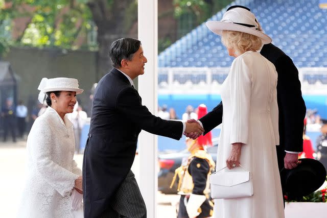 <p>KIN CHEUNG/POOL/AFP via Getty </p> Empress Masako and Emperor Naruhito greet King Charles and Queen Camilla at the ceremonial welcome for the state visit on June 25, 2024 in London.