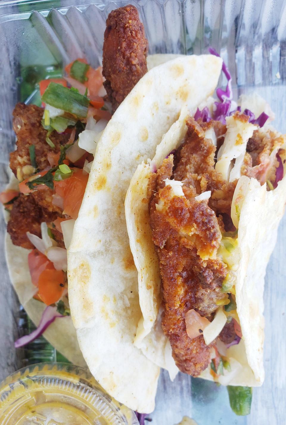 Crispy fish tacos are available at Trojan Horse.