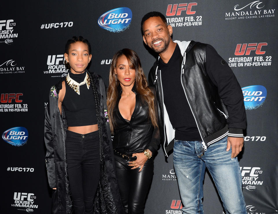 LAS VEGAS, NV - FEBRUARY 22:  (L-R) Singer/actress Willow Smith, actress/producer Jada Pinkett Smith and actor Will Smith attend the UFC 170 event at the Mandalay Bay Events Center on February 22, 2014 in Las Vegas, Nevada.  (Photo by Ethan Miller/Getty Images)