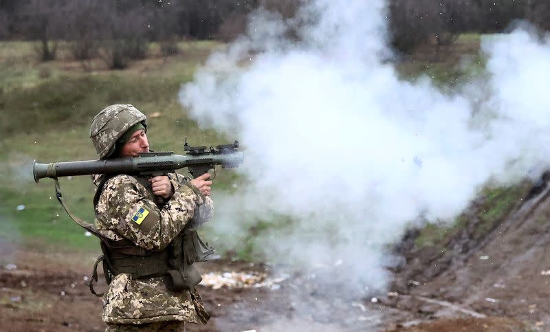 Ukrainian servicemen test their weapons on a training ground in Bakhmut region