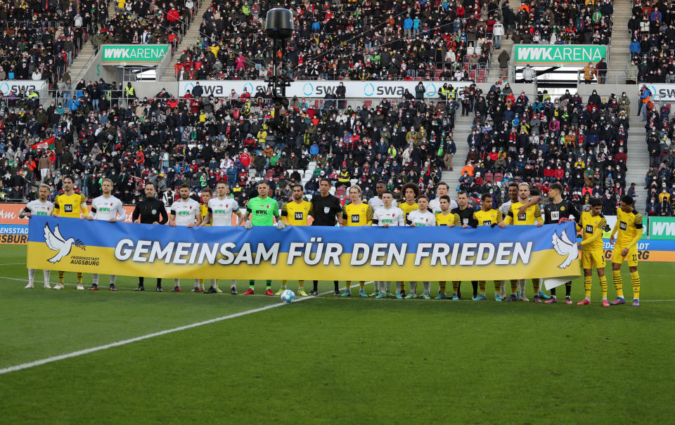 AUGSBURG, GERMANY - FEBRUARY 27: A minute of silence is observed because of the war in Ukraine before the Bundesliga match between FC Augsburg and Borussia Dortmund at WWK-Arena on February 27, 2022 in Augsburg, Germany. / Credit: Stefan Matzke - sampics/Corbis via Getty Images