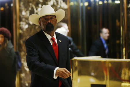 FILE PHOTO: Milwaukee County Sheriff David Clarke Jr. departs after a meeting with U.S. President elect Donald Trump at Trump Tower New York, U.S., November 28, 2016. REUTERS/Lucas Jackson/File Photo