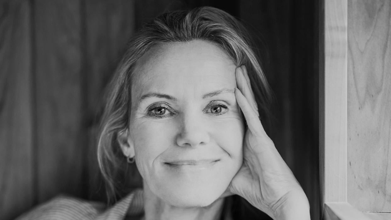 Woman smiling in a sauna