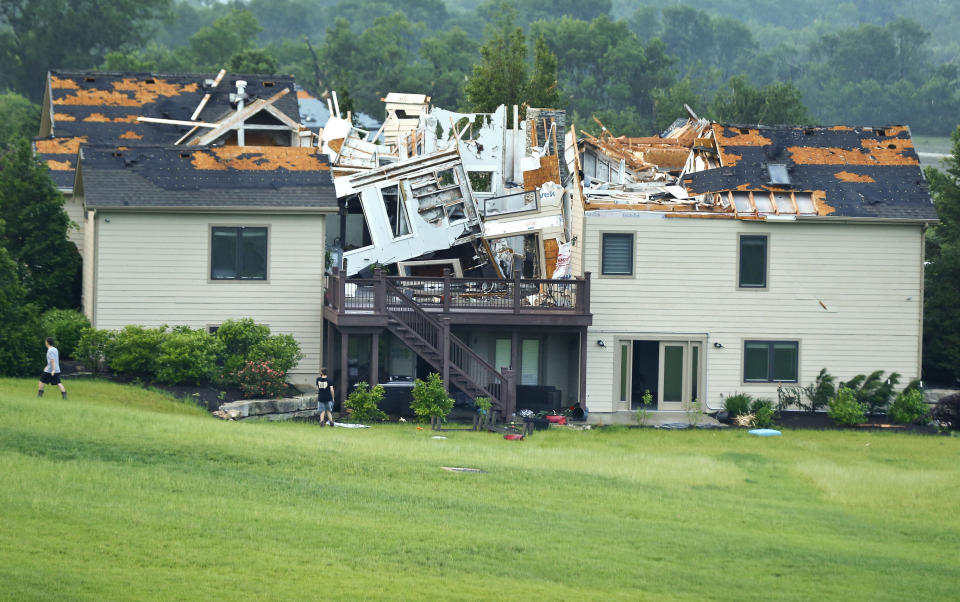 A destroyed home sits in a neighborhood after it was hit by a tornado on Tuesday, May 28, 2019, south of Lawrence, Kan., near US-59 highway and N. 1000 Road. The past couple of weeks have seen unusually high tornado activity in the U.S., with no immediate end to the pattern in sight. (Chris Neal/The Topeka Capital-Journal via AP)