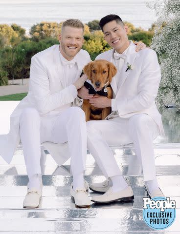 <p>HEATHER KINCAID PHOTOGRAPHER</p> Scott Hoying (left) and Mark Manio wear matching off-white tuxedos for their wedding.