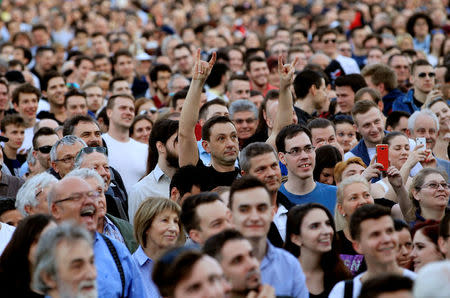 People attend a protest against the government of Prime Minister Viktor Orban in Budapest, Hungary, April 14, 2018. REUTERS/Bernadett Szabo