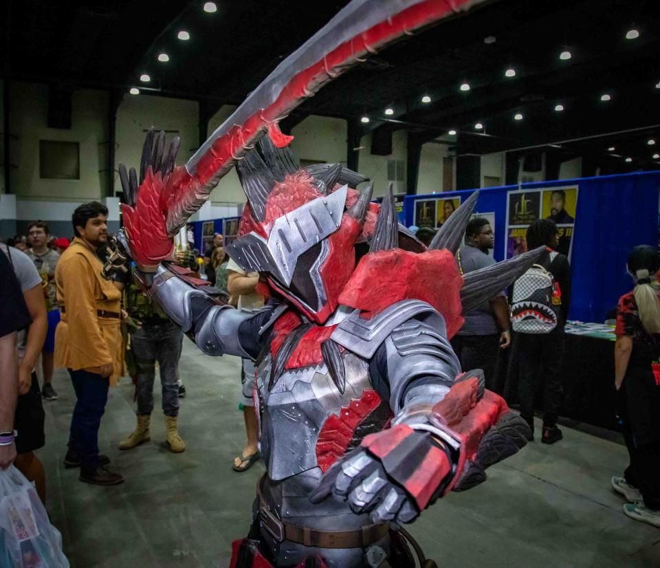 Victor Del Corro, 29, of West Palm Beach, is dressed up as Rathalos from Monster Hunter during the Ultracon Comic Con event at the South Florida Fairgrounds Expo Center on Saturday, August 26, 2023.