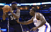 Memphis Grizzlies forward Zach Randolph (50) faces the basket as Oklahoma City Thunder center Kendrick Perkins (5) defends during the first quarter of Game 1 of the opening-round NBA basketball playoff series in Oklahoma City on Saturday, April 19, 2014. (AP Photo/Alonzo Adams)