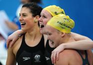 In this August 14, 2008 photograph, Australia's Stephanie Rice, Bronte Barratt and Kylie Palmer celebrate after team member Linda Mackenzie arrived first in the women's 4x200m freestyle relay swimming final at the National Aquatics Center during the 2008 Beijing Olympic Games in Beijing. (MARTIN BUREAU/AFP/Getty Images)