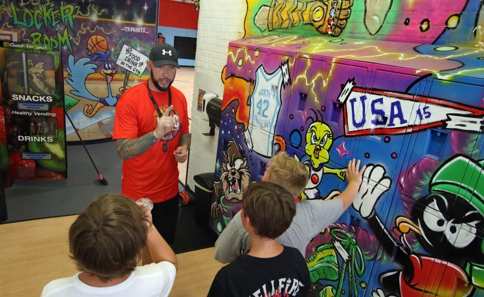 Kris Lang talks to kids during a water break Thursday morning, Aug. 4, 2022, at Kris Lang Sports Complex on East Catawba Street in Belmont.