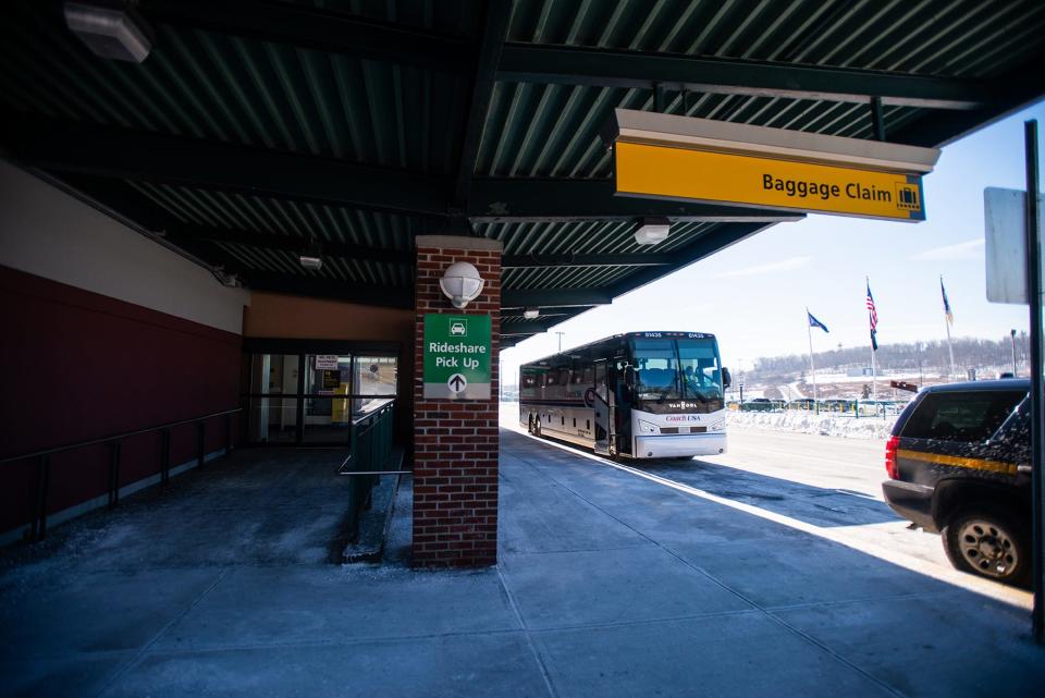 The luxury express coach bus that brings airline passengers from New York Stewart International Airport to Manhattan, right, at New York Stewart International Airport in New Windsor, NY on Tuesday, February 1, 2022.