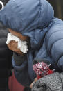 A family member mourns at the scene where their loved ones were killed early Sunday, May 9, 2021, in Colorado Springs, Colo. The suspected shooter was the boyfriend of a female victim at the party attended by friends, family and children. He walked inside and opened fire before shooting himself, police said. Children at the attack weren’t hurt and were placed with relatives. (Jerilee Bennett/The Gazette via AP)