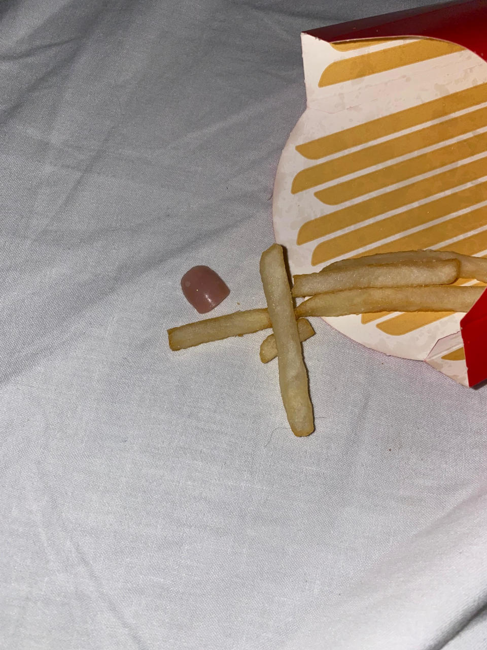 False nail with purple polish in McDonald's fries pack. Source: Supplied