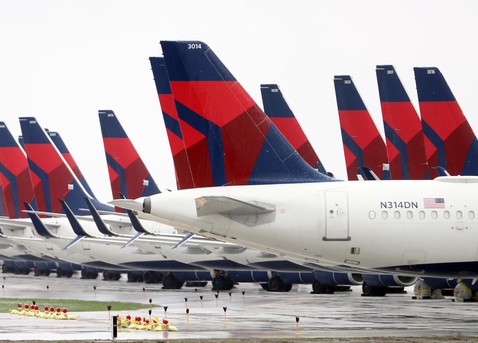 Planes belonging to Delta Air Lines sit idle at Kansas City International Airport on Friday.&nbsp; (Photo: Jamie Squire via Getty Images)