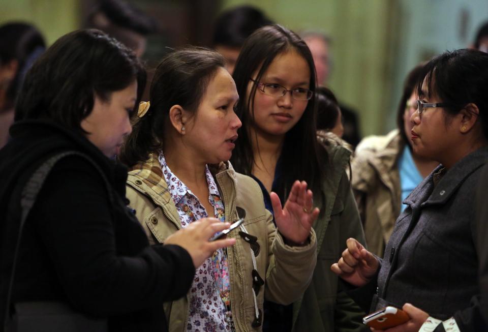 Filipinos living in Belfast, attend a book of condolence service at the City Hall in Belfast. The United Kingdom (UK) Supreme court ruled that diplomats who treat staff as 