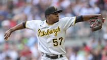 Pittsburgh Pirates relief pitcher Yerry De Los Santos winds up during the seventh inning of the team's baseball game against the Atlanta Braves on Saturday, June 11, 2022, in Atlanta. (AP Photo/Hakim Wright Sr.)