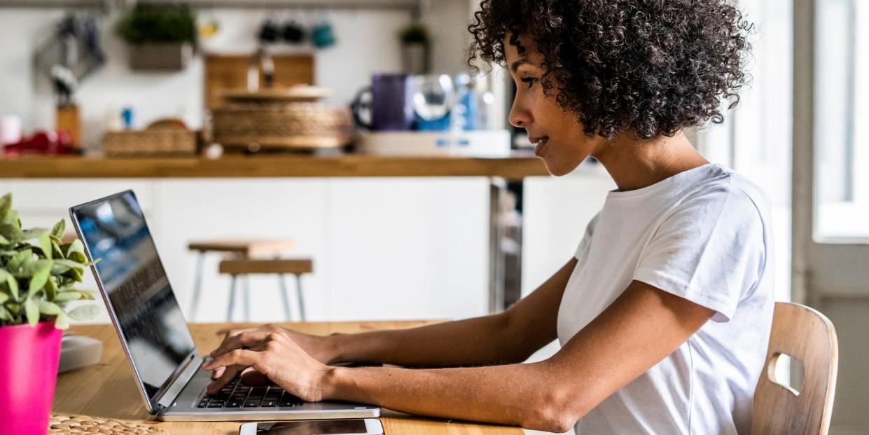 woman using computer at home