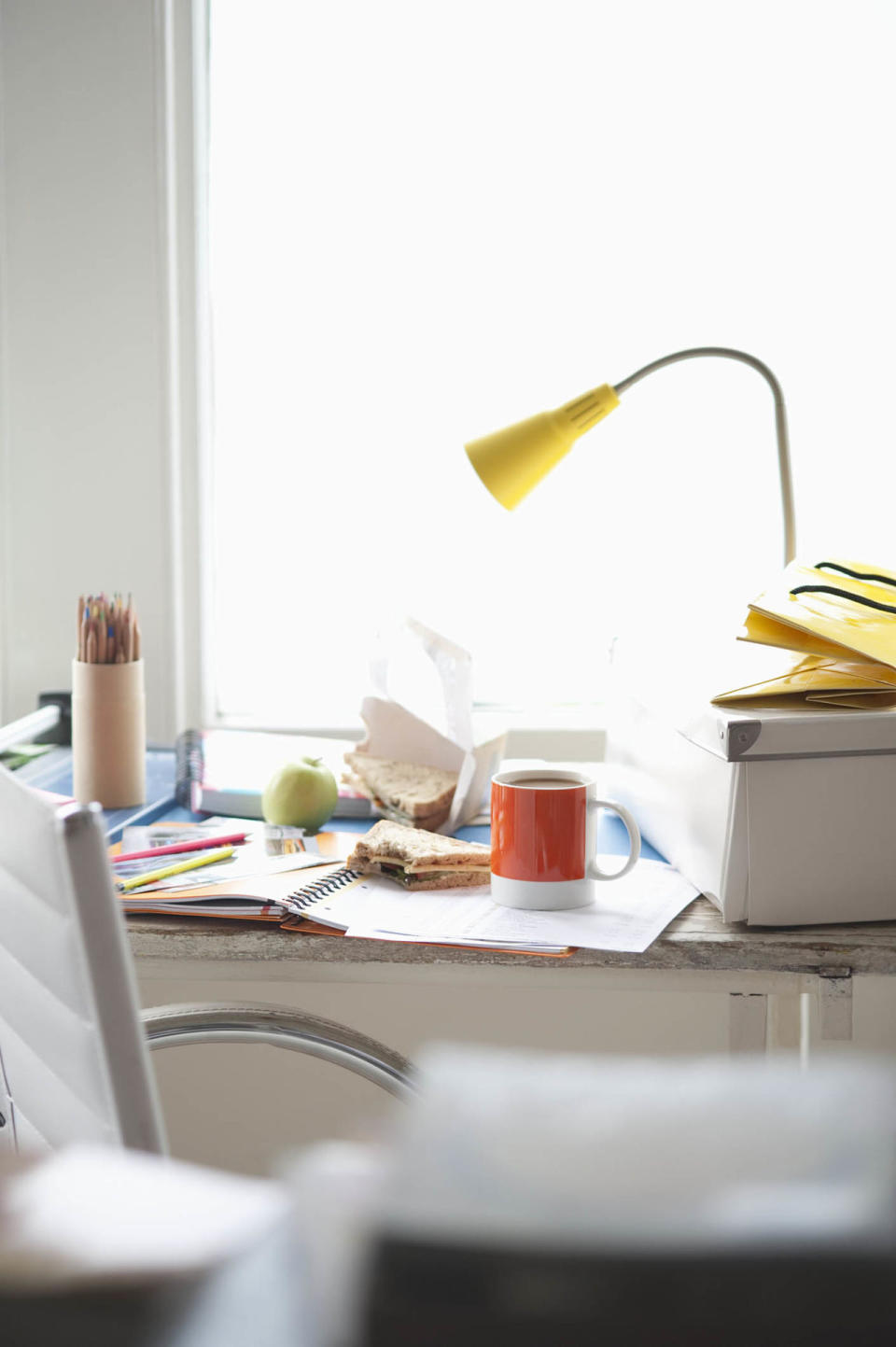 <p>If you're constantly turning down plans, your <a rel="nofollow noopener" href="http://www.housebeautiful.com/lifestyle/news/a5563/desk-clutter-makes-you-tired/" target="_blank" data-ylk="slk:disorganized desk;elm:context_link;itc:0;sec:content-canvas" class="link ">disorganized desk</a> might be to blame. According to research from <a rel="nofollow noopener" href="https://paw.princeton.edu/issues/2015/06/03/pages/9642/index.xml" target="_blank" data-ylk="slk:Princeton University;elm:context_link;itc:0;sec:content-canvas" class="link ">Princeton University</a>, visual clutter competes with your brain's ability to pay attention and tires out your cognitive functions, making you more mentally and physically exhausted.</p>