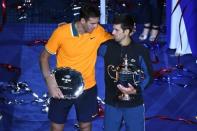Sep 9, 2018; New York, NY, USA; (L-R) Juan Martin Del Potro of Argentina and Novak Djokovic of Serbia poses with the runner-up and championship trophies (respectively) on day fourteen of the 2018 U.S. Open tennis tournament at USTA Billie Jean King National Tennis Center. Mandatory Credit: Danielle Parhizkaran-USA TODAY Sports