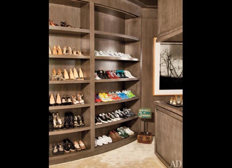 It's no surprise that this funny girl, who's known for her moves on the dance floor, has a closet devoted to sneakers. We love how the colors pop against the wood! Find out whose shoes these are <a href="http://www.stylelist.com/2011/10/11/ellen-degeneres-and-portia-de-rossi-architectural-digest_n_1004841.html" target="_hplink">here</a>.     Photo courtesy of Architectural Digest.