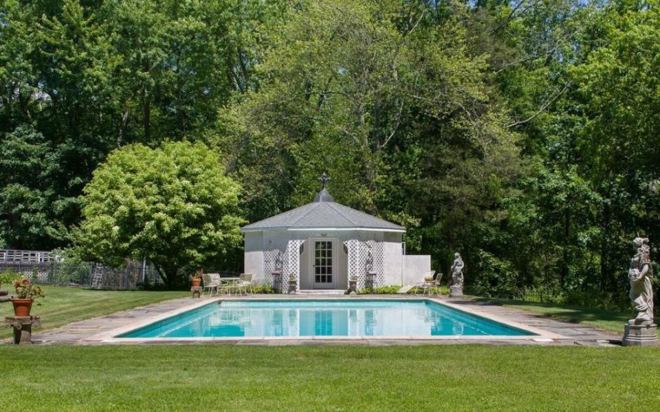 <p>The pool house next to the 22-by-48-foot pool includes a kitchen and cabana.</p>