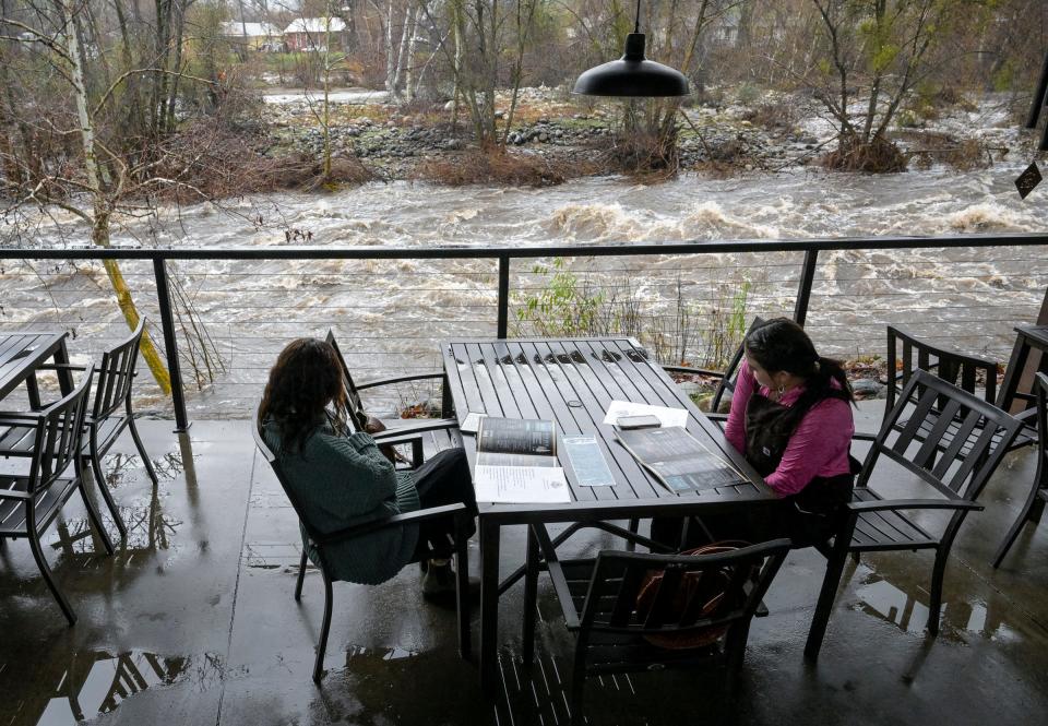 Customers of the River View Grill & Bar in Three Rivers take in the view of the Kaweah River on Tuesday, January 10, 2023.