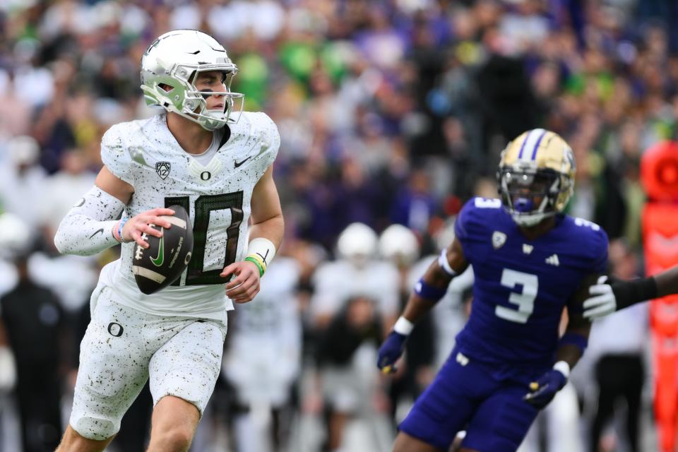 Oregon Ducks quarterback Bo Nix (10) looks to pass the ball during the first half against the Washington Huskies at Alaska Airlines Field at Husky Stadium on Oct. 14 in Seattle.