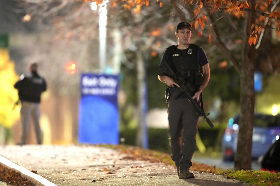 FILE - Law enforcement officers carry rifles outside Central Maine Medical Center during an active shooter situation in Lewiston, Maine, Wednesday, Oct. 25, 2023. Thousands of pages Maine State Police documents released Friday, June 7, 2023, include detailed descriptions of the chaos and carnage surrounding the state’s deadliest mass shooting. (AP Photo/Steven Senne, File)