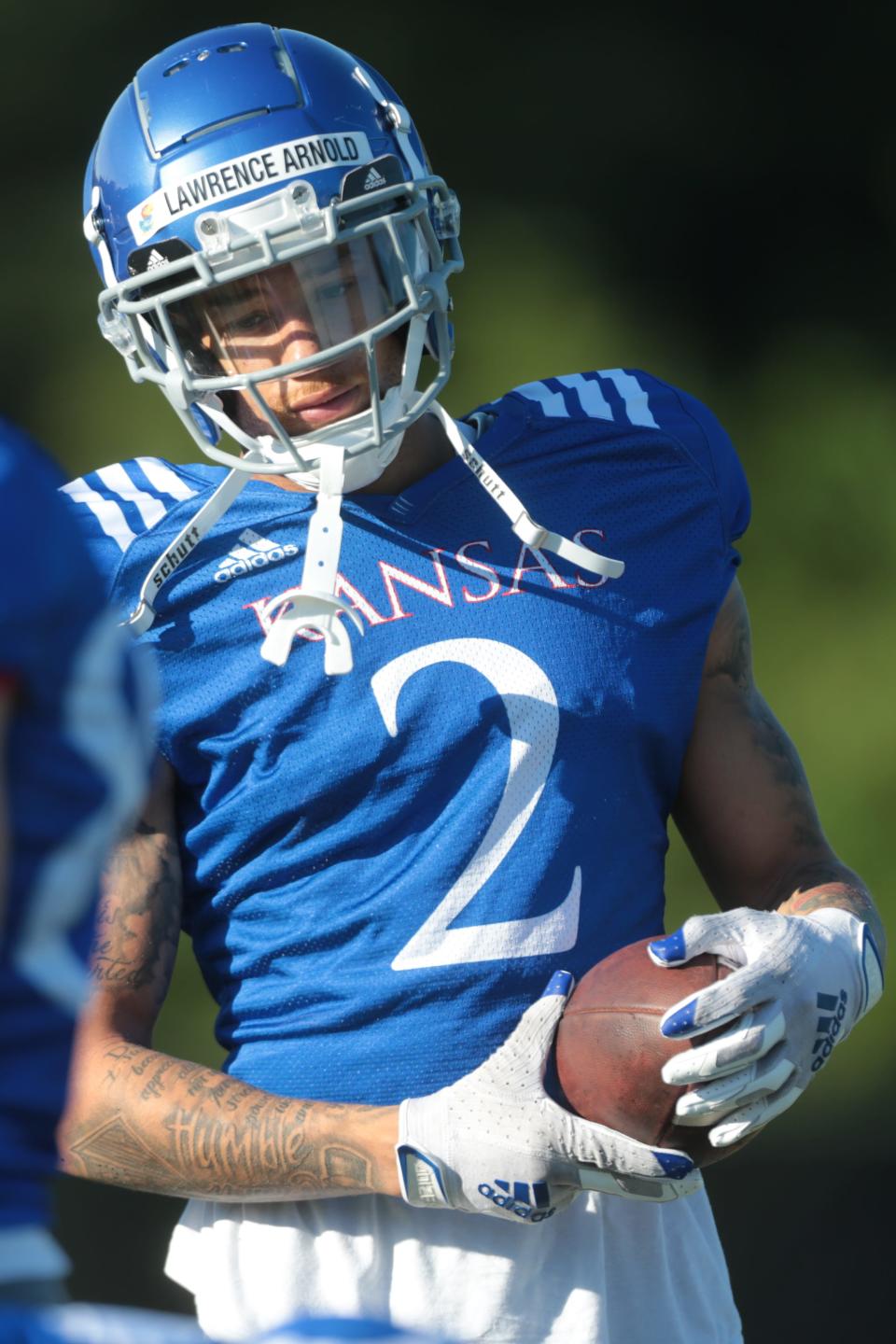 Kansas redshirt sophomore wide receiver Lawrence Arnold (2) works through drills during practice Tuesday morning.