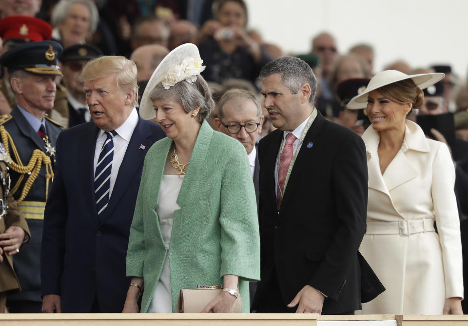 President Donald Trump, British Prime Minister Theresa May, second left, and first lady Melania Trump, right, arrive for an event to mark the 75th anniversary of D-Day in Portsmouth, England Wednesday, June 5, 2019. World leaders including U.S. President Donald Trump are gathering Wednesday on the south coast of England to mark the 75th anniversary of the D-Day landings. (AP Photo/Matt Dunham)