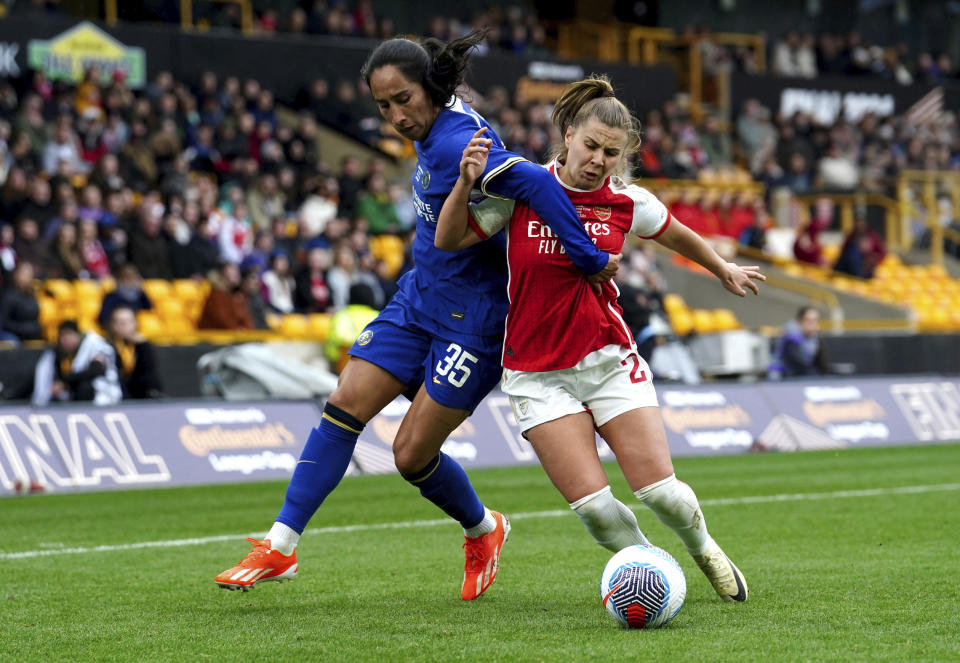 Arsenal's Victoria Pelova, right, battles for the ball against Chelsea's Mayra Ramirez during the FA Women's Continental Tyres League Cup Final at Molineux Stadium, Wolverhampton, England, Sunday March 31, 2024. (David Davies/PA via AP)
