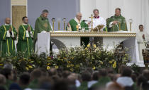 Pope Francis, center, celebrates Mass at Santakos Park, in Kaunas, Lithuania, Sunday, Sept. 23, 2018. Francis paid tribute Sunday to Lithuanians who suffered and died during Soviet and Nazi occupations on the day the country remembers the near-extermination of its centuries-old Jewish community during the Holocaust. (AP Photo/Mindaugas Kulbis)