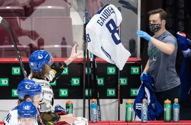 The Vancouver Canucks traded Adam Gaudette to Chicago for forward Matthew Highmore. Gaudette was the first Canucks player to be diagnosed with COVID-19. (Darryl Dyck/THE CANADIAN PRESS - image credit)