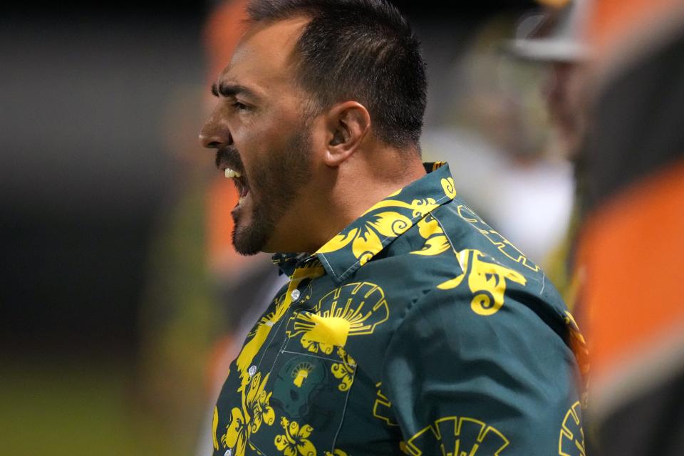 Canyon del Oro head coach Dustin Peace yells out to his team as they take on St. Mary's on Friday, Sept. 30, 2022. 