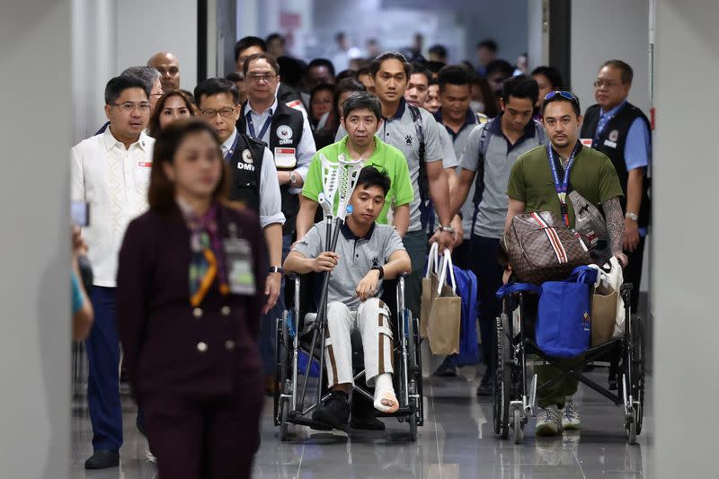 Filipino seafarers who survived the deadly Houthi attack on the commercial ship True Confidence arrive at Manila International Airport