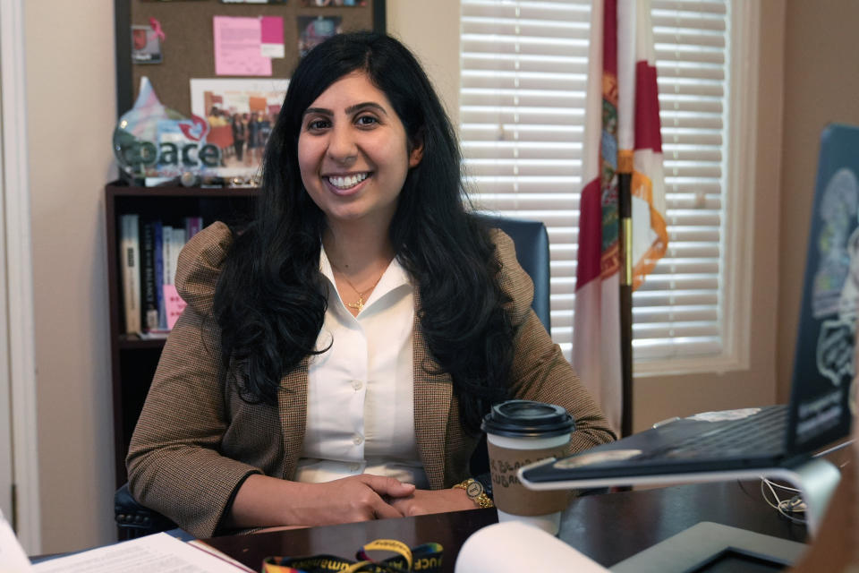 Florida state Rep. Anna Eskamani smiles in her office Wednesday, March 27, 2024, in Orlando, Fla. For the first time in 27 years, the U.S. government is announcing changes to how it categorizes people by race and ethnicity. "It feels good to be seen," said Eskamani, whose parents are from Iran. (AP Photo/John Raoux)