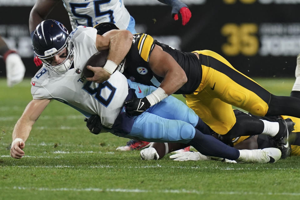 Tennessee Titans quarterback Will Levis (8) is sacked by Pittsburgh Steelers linebacker Alex Highsmith, left, during the first half of an NFL football game Thursday, Nov. 2, 2023, in Pittsburgh. (AP Photo/Matt Freed)