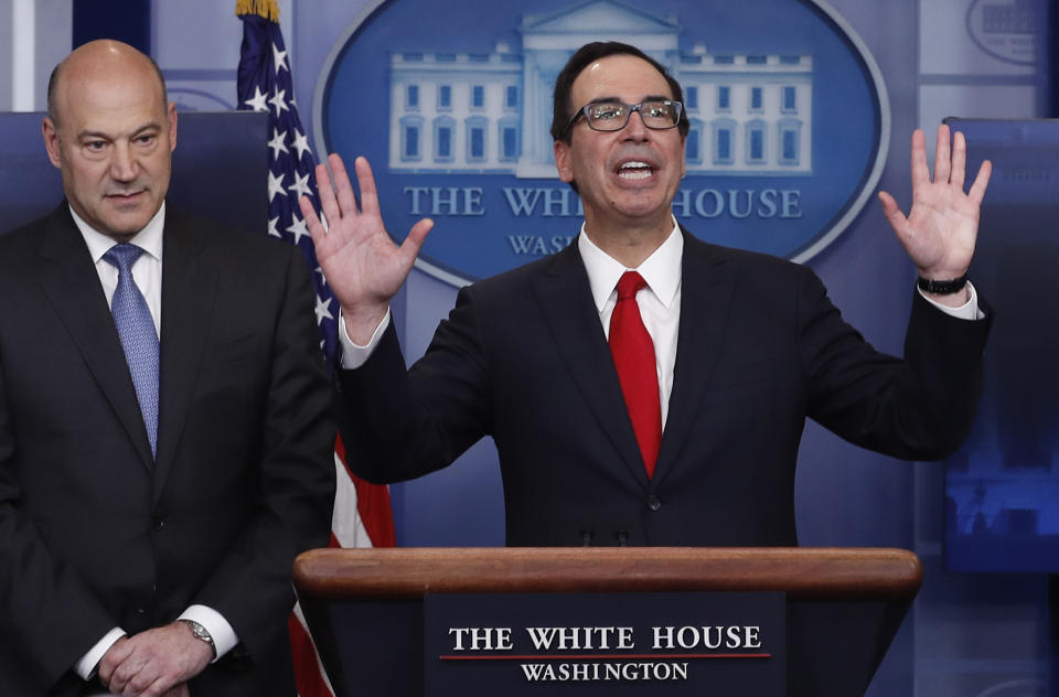 Treasury Secretary Steven Mnuchin and National Economic Director Gary Cohn introduce Donald Trump’s tax blueprint in the White House briefing room on April 26th (AP Photo/Carolyn Kaster)