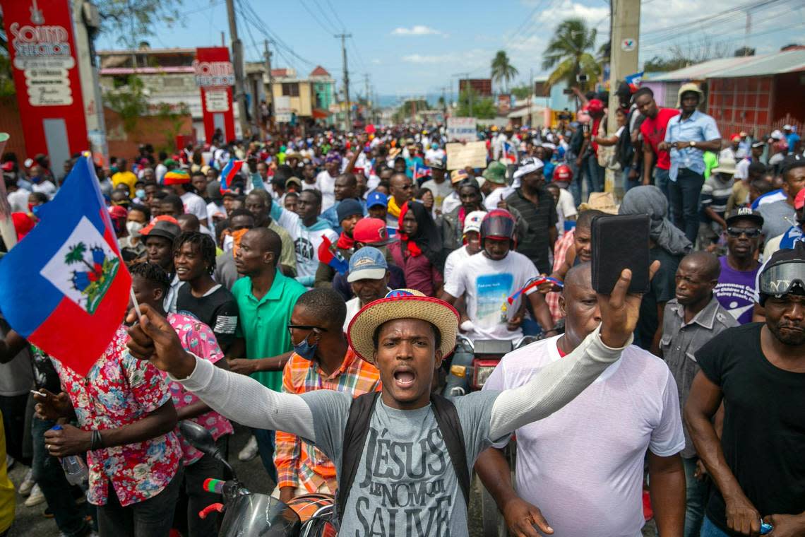 People protest to demand the resignation of Haitian President Jovenel Moïse in Port-au-Prince, Haiti, on Feb. 28, 2021. The opposition is disputing the mandate of Moise, whose term they claim ended on Feb. 7, but the president and his supporters say his five-year term expires in 2022. Moïse was later killed, in July 2021.