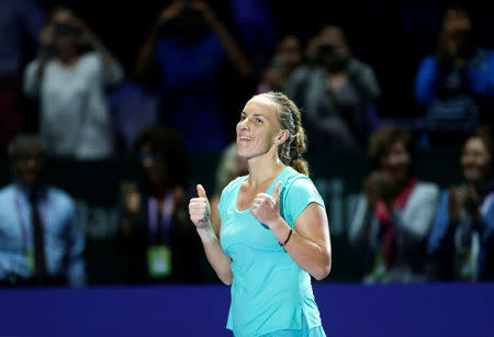 Tennis - Singapore WTA Finals Round Robin Singles - National Indoor Stadium, Singapore - 24/10/2016 - Svetlana Kuznetsova of Russia celebrates after defeating Agnieszka Radwanska of Poland. REUTERS/Edgar Su