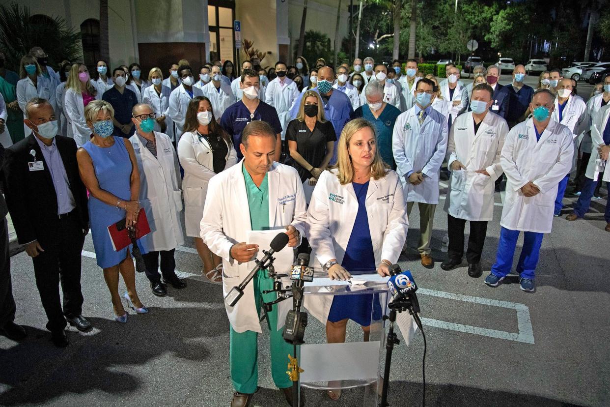 Dr. Rupesh Dharia and Dr. Jennifer Buczyner speak out as a group of physicians and administrators gathered in Palm Beach Gardens early Monday morning, August 23, 2021 to support vaccinations and the wearing of masks in their fight against COVID-19.