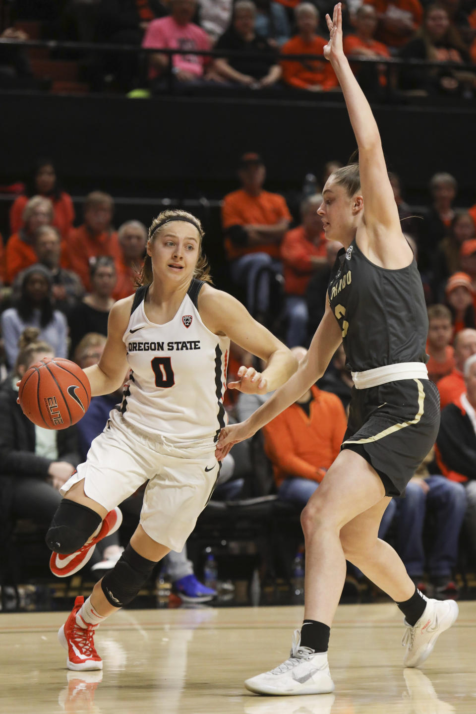 Colorado's Emma Clarke (3) defends against Oregon State's Mikayla Pivec (0) during the first half of an NCAA college basketball game in Corvallis, Ore., Sunday, Jan. 5, 2020. (AP Photo/Amanda Loman)