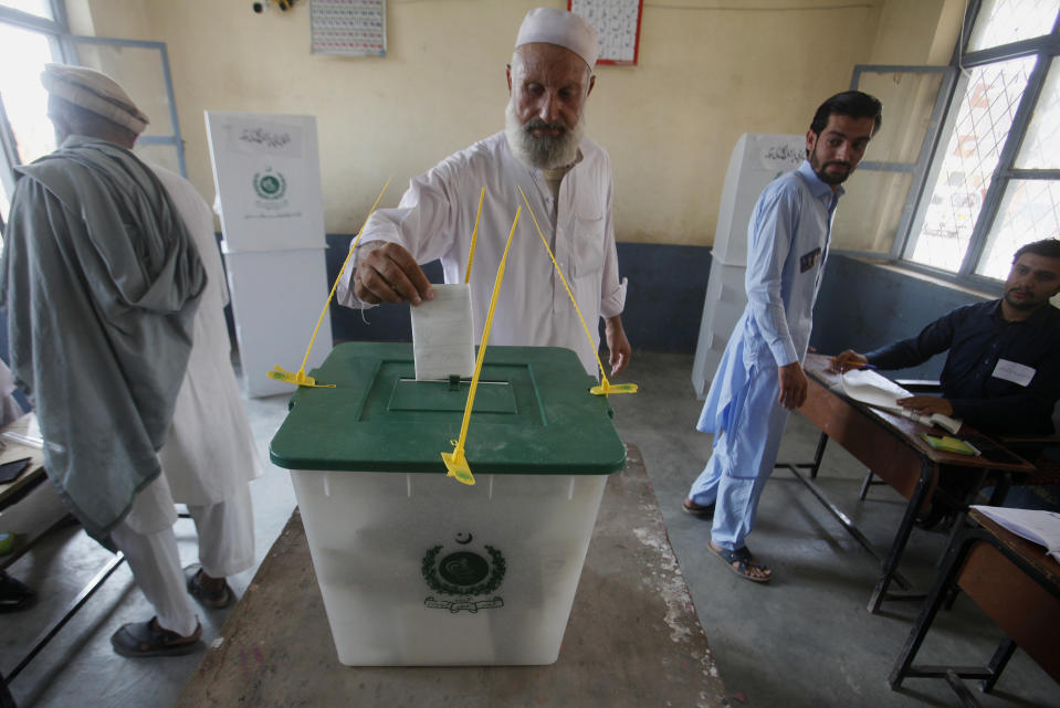 A Pakistani tribesman cast his vote during an election for provincial seats in Jamrud, a town of Khyber district, Pakistan, Saturday, July 20, 2019. Pakistan's northwestern tribal areas are holding their first-ever provincial elections. The seven tribal areas were merged last year as tribal districts into the northwestern Khyber Pakhtunkhwa province. Before that, the tribal areas were federally administered, and residents could only vote in the national assembly. (AP Photo/Muhammad Sajjad)
