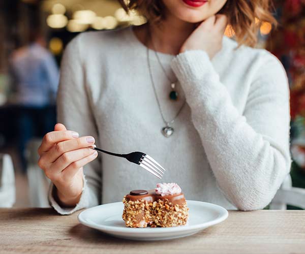 woman eating dessert